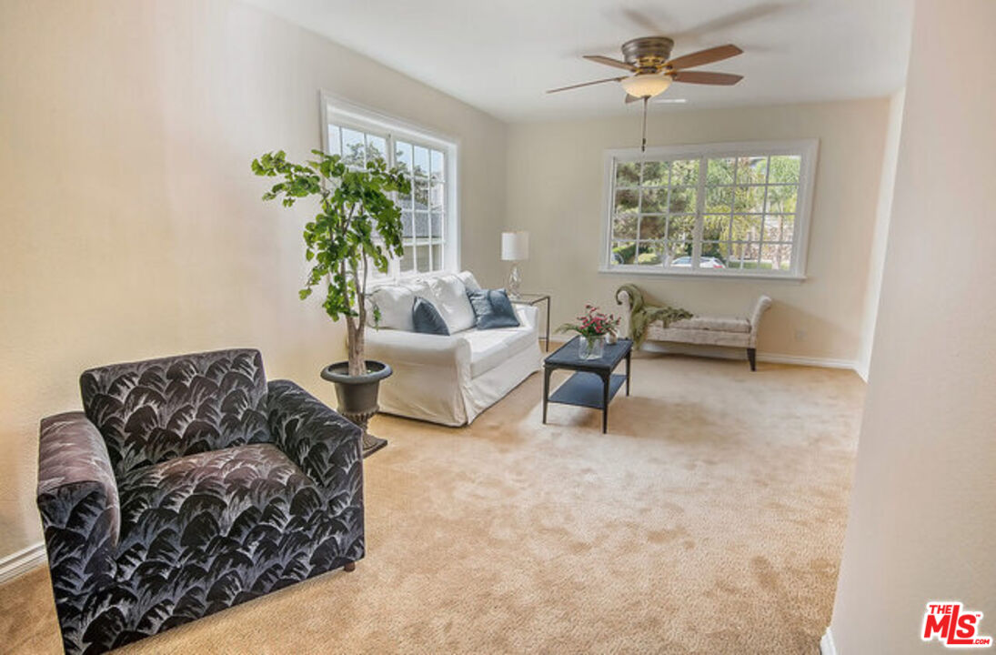 7830 West 83rd Street Playa del Rey, CA 90293 - Photo 36 of 74 a living room with furniture and a potted plant