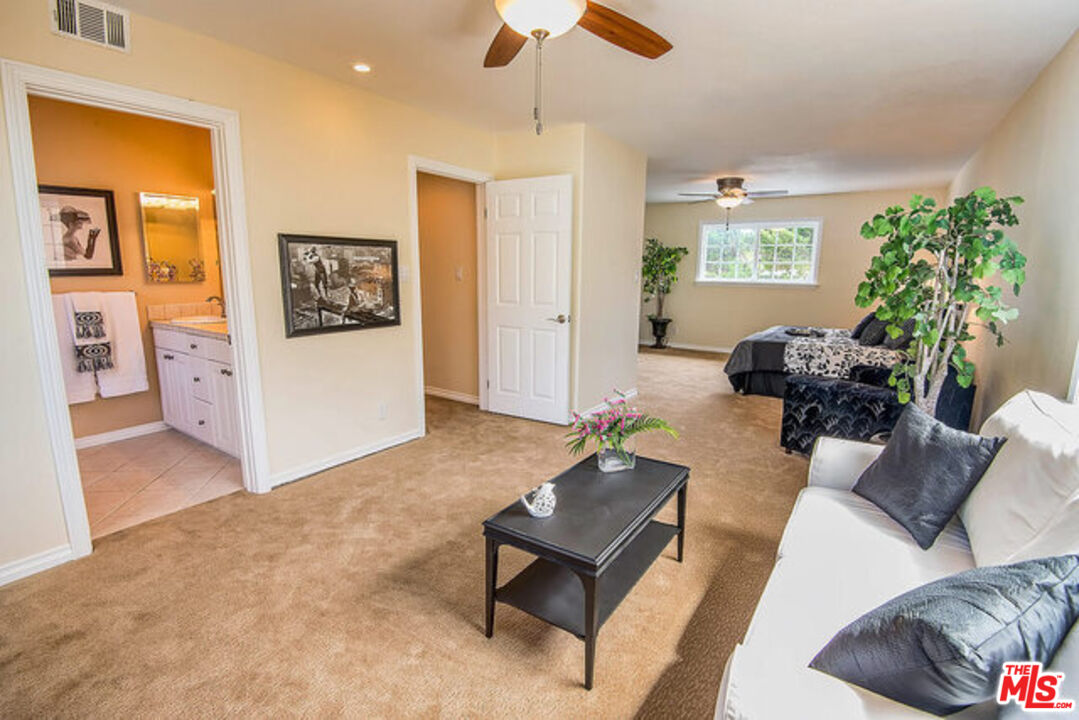 7830 West 83rd Street Playa del Rey, CA 90293 - Photo 38 of 74 a living room with furniture and a potted plant