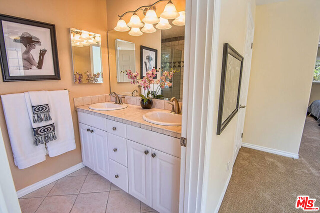 7830 West 83rd Street Playa del Rey, CA 90293 - Photo 39 of 74 a bathroom with a sink and a mirror