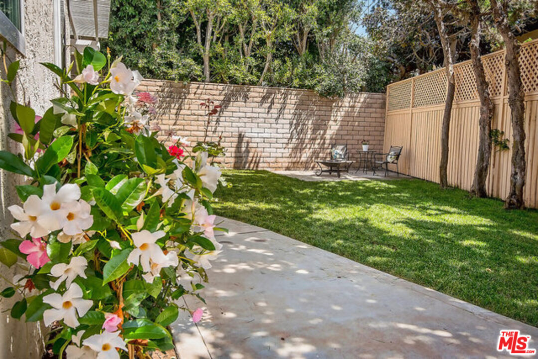 7830 West 83rd Street Playa del Rey, CA 90293 - Photo 48 of 74 a backyard of a house with a garden and plants