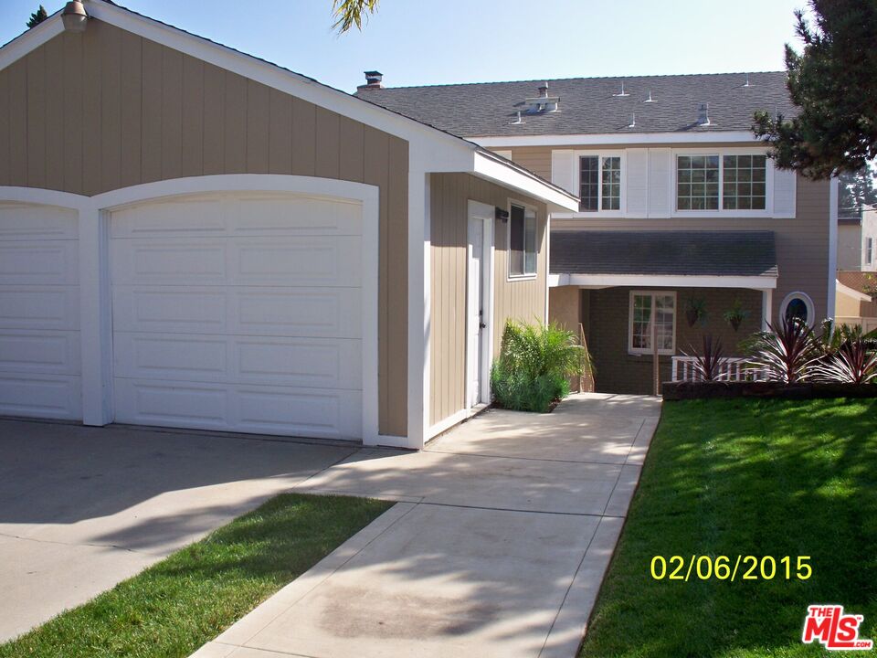 7830 West 83rd Street Playa del Rey, CA 90293 - Photo 55 of 74 a front view of a house with a yard
