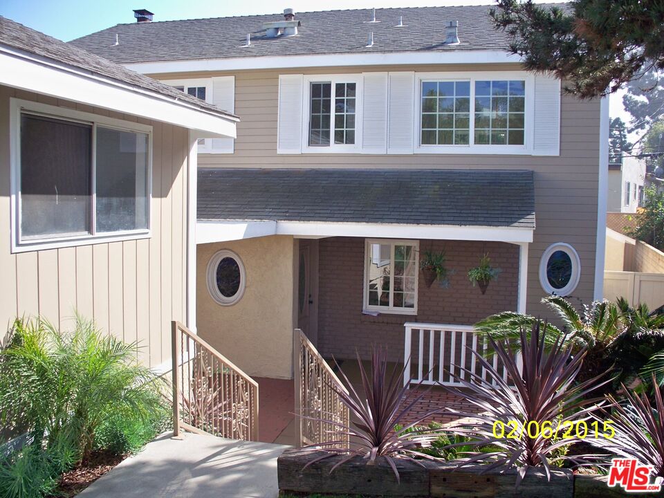 7830 West 83rd Street Playa del Rey, CA 90293 - Photo 57 of 74 a front view of a house with a yard