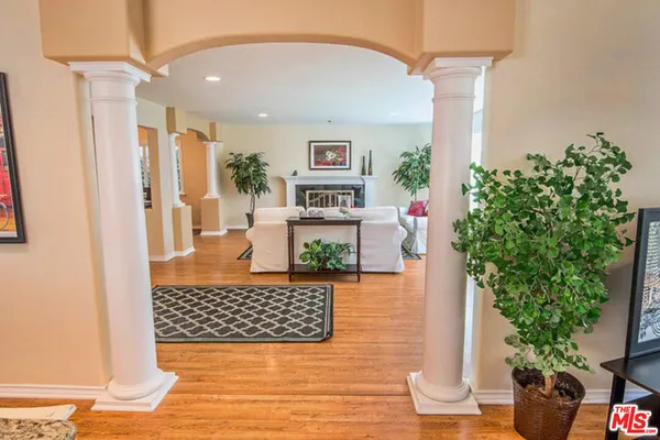a view of a dining room with furniture and chandelier