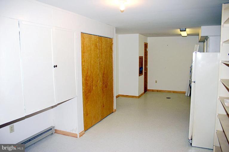 1907 Ridgewood Court Hampstead, MD 21074 - Photo 20 of 25 a view of a room with closet and a refrigerator