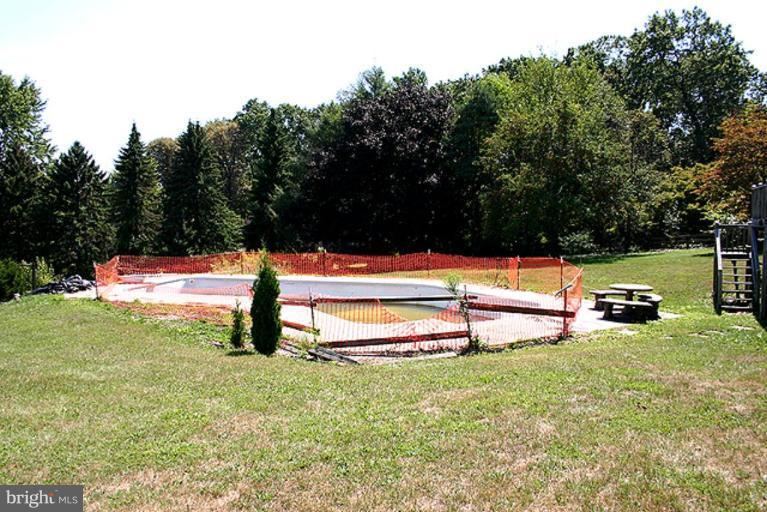 1907 Ridgewood Court Hampstead, MD 21074 - Photo 22 of 25 a park view with a bench and trees