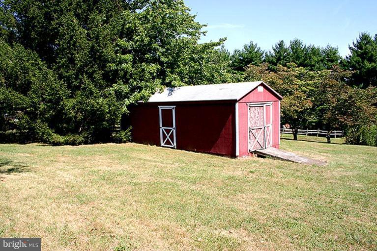 1907 Ridgewood Court Hampstead, MD 21074 - Photo 24 of 25 a view of a house with a yard and garage
