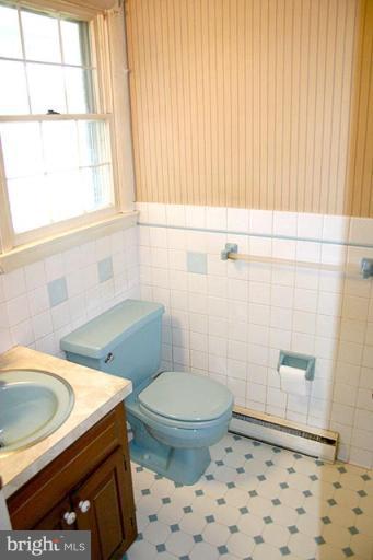 1907 Ridgewood Court Hampstead, MD 21074 - Photo 8 of 25 a bathroom with a sink a toilet a window and shower