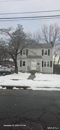 a front view of a house with a snow