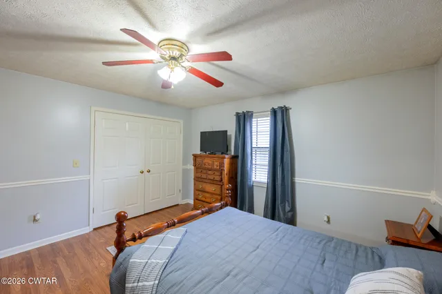 a bathroom with a bathtub shower sink vanity and toilet