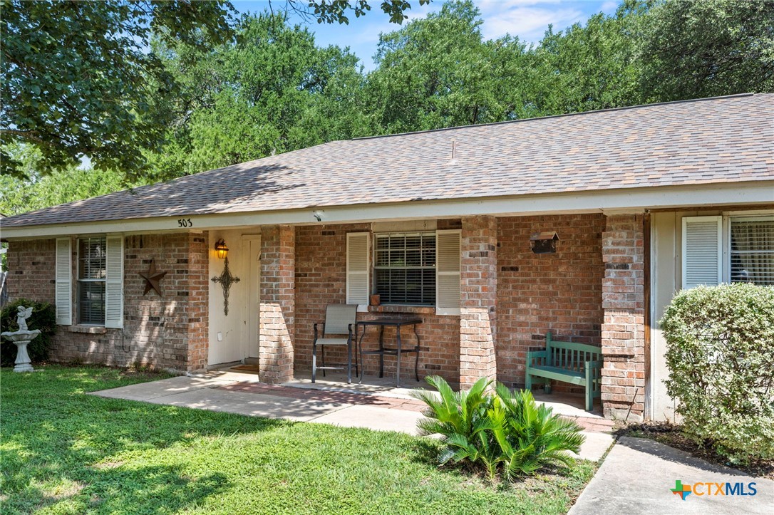 503 Thornton Lane Georgetown, TX 78628 - Photo 1 of 1 a front view of a house with garden