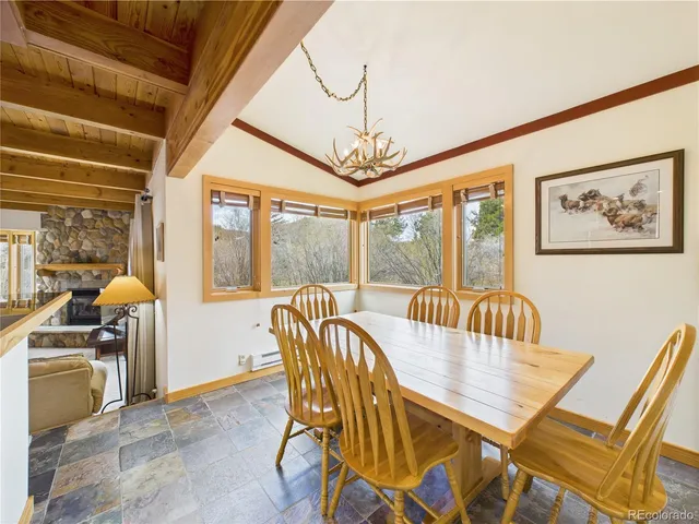 a spacious bedroom with a bed and large window