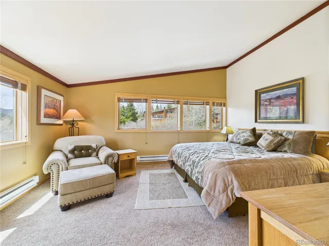 a bathroom with a sink toilet vanity and shower