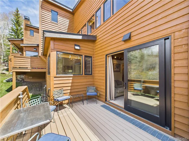 a view of a brick house with a large window