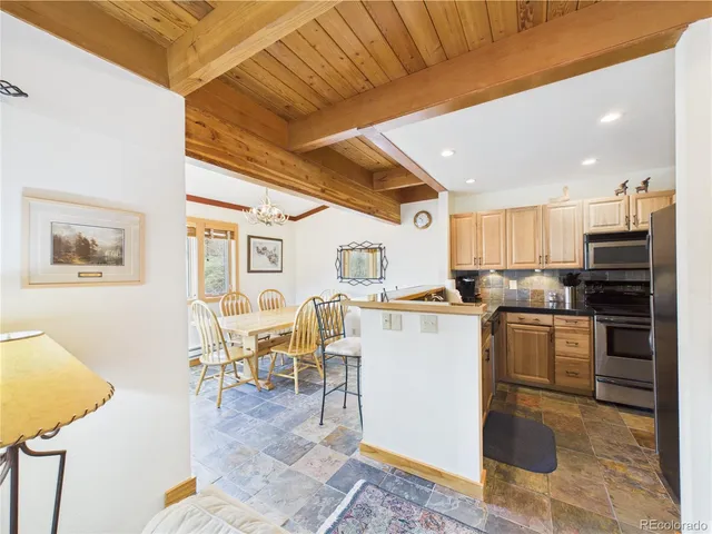 a kitchen with a sink appliances and cabinets