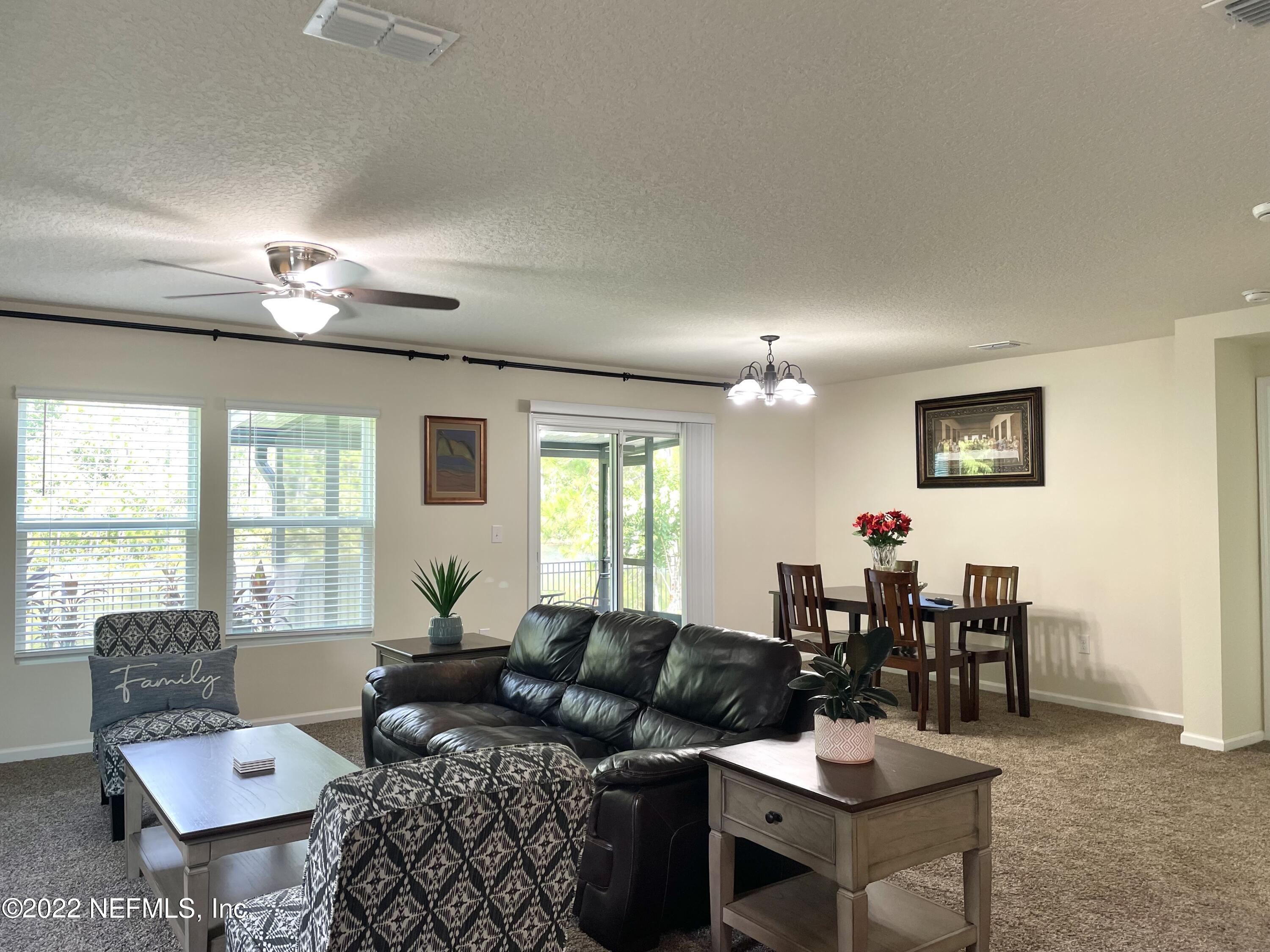 117 Lakeside Court Bunnell, FL 32110 - Photo 12 of 42 FAMILY ROOM & DINING AREA