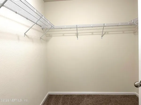 a view of a room with racks on the wall