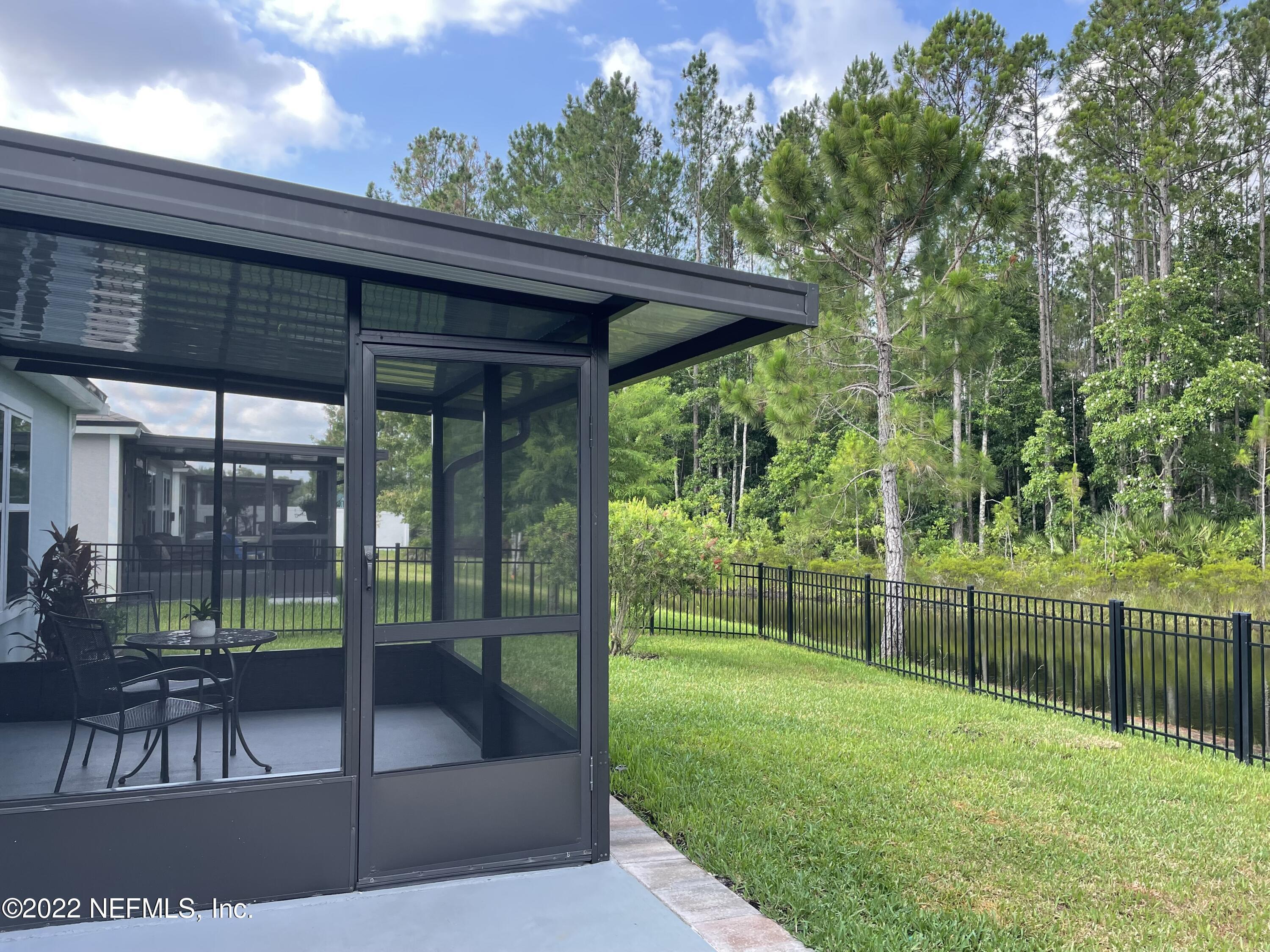 117 Lakeside Court Bunnell, FL 32110 - Photo 26 of 42 EXTENDED PATIO AND LANAI