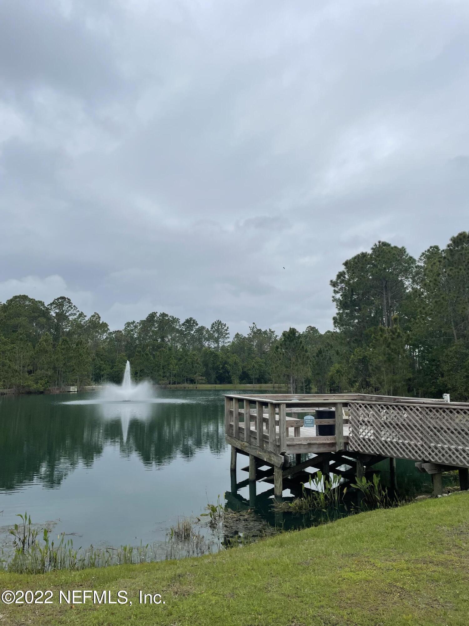117 Lakeside Court Bunnell, FL 32110 - Photo 40 of 42 COMMUNITY POND AND DOCK