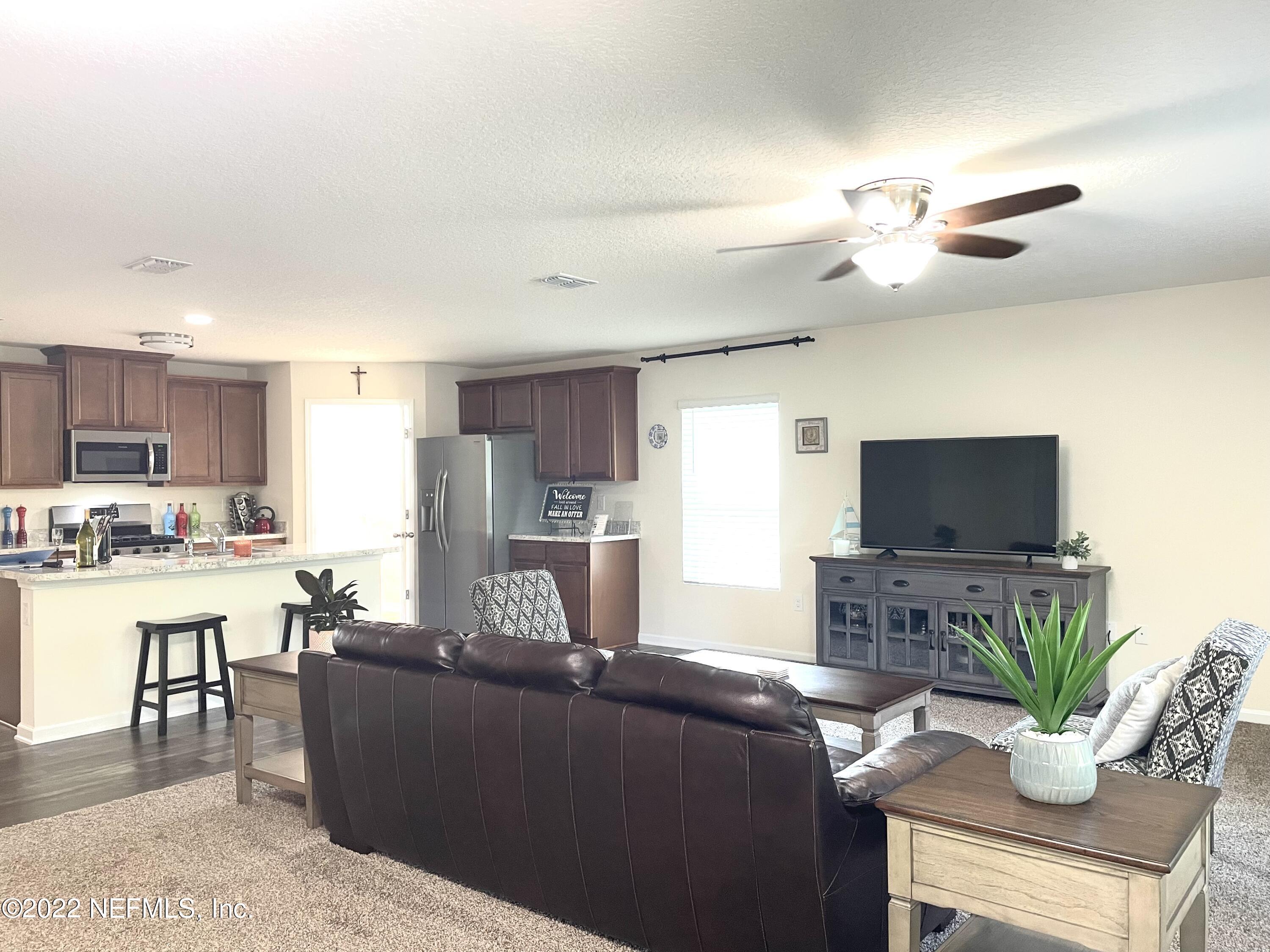 117 Lakeside Court Bunnell, FL 32110 - Photo 9 of 42 FAMILY ROOM TO KITCHEN