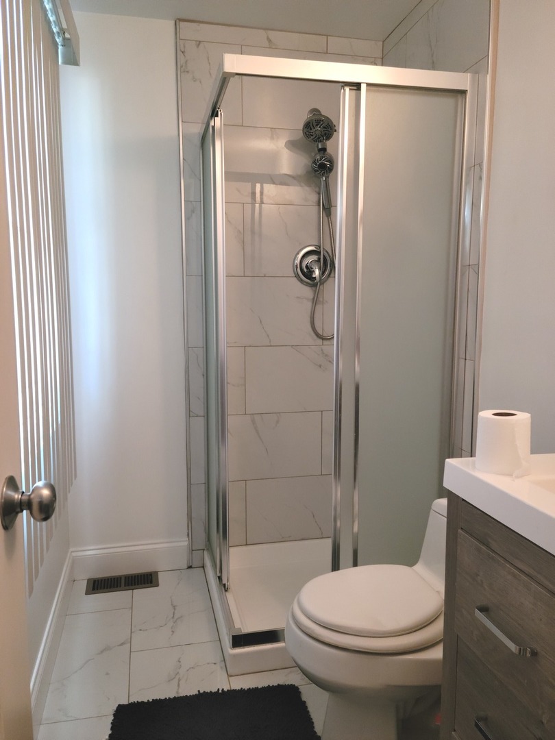 286 Seabury Road Bolingbrook, IL 60440 - Photo 12 of 15 a bathroom with a toilet and a shower