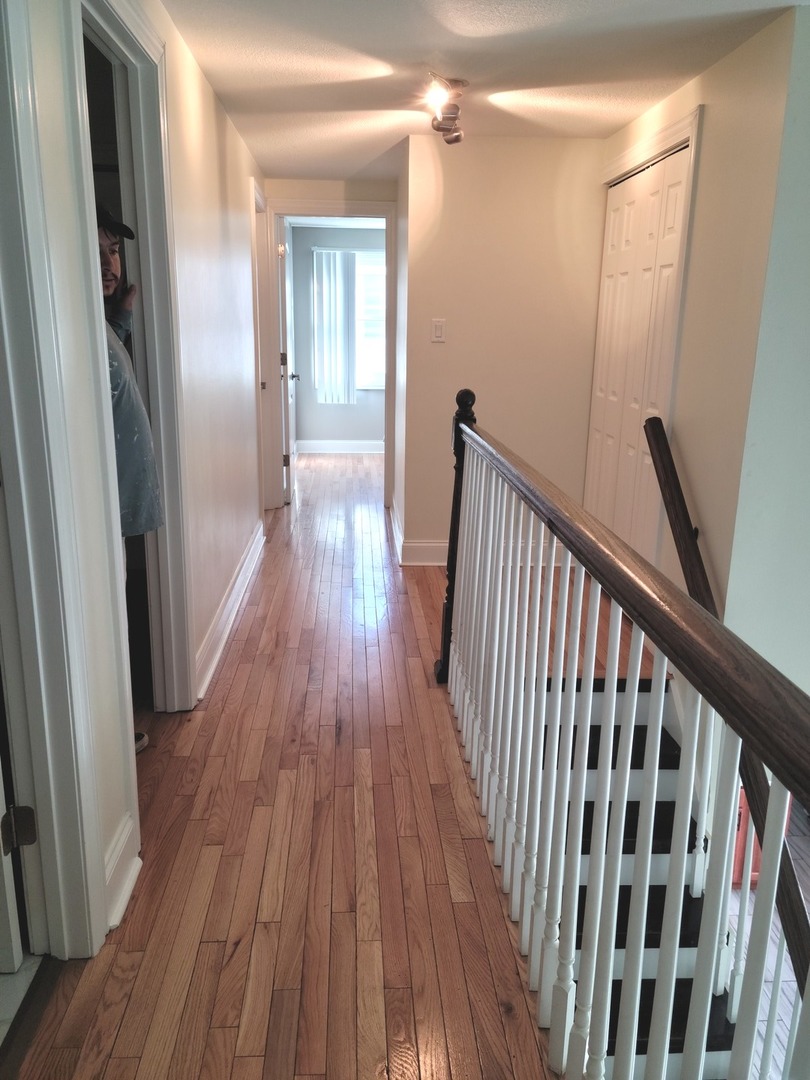 286 Seabury Road Bolingbrook, IL 60440 - Photo 13 of 15 a view of a hallway with wooden floor and staircase
