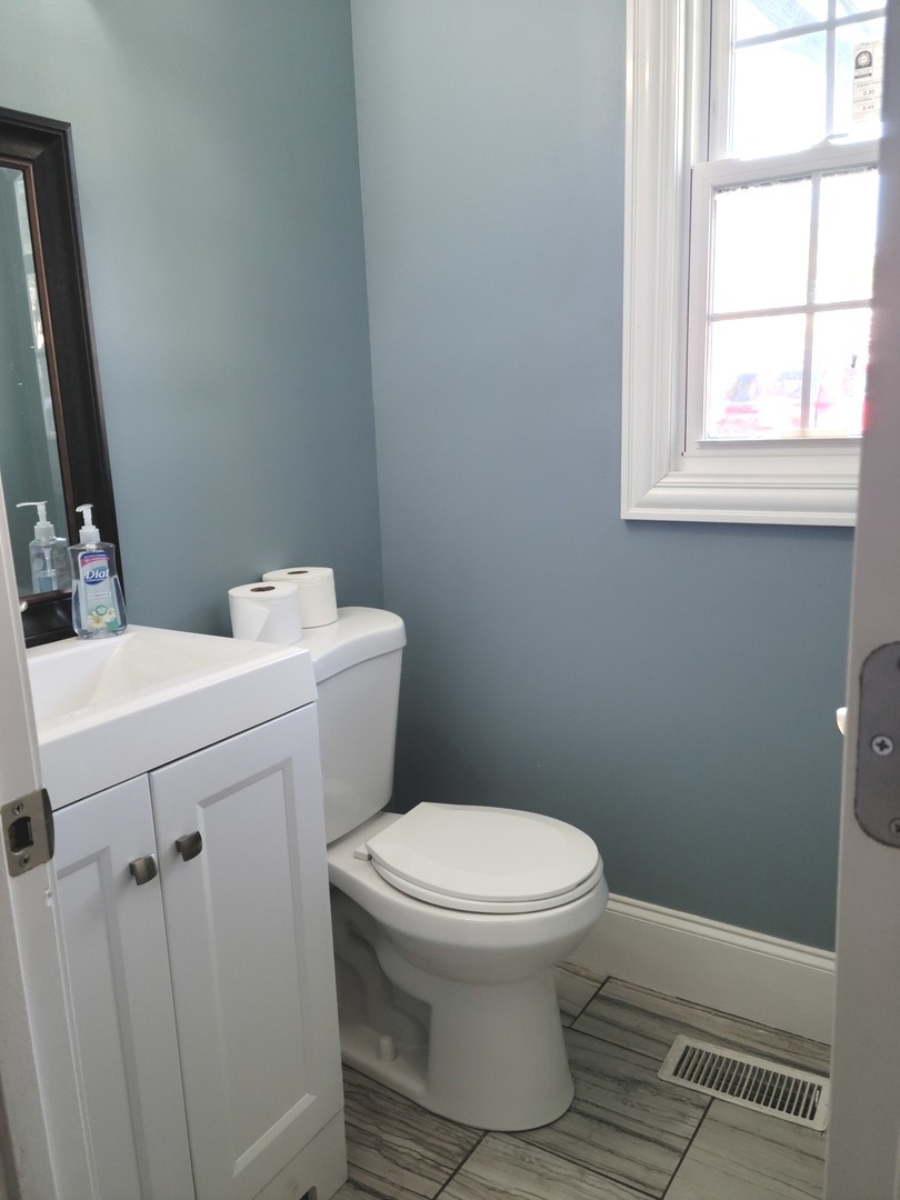 286 Seabury Road Bolingbrook, IL 60440 - Photo 4 of 15 a bathroom with a sink toilet and window