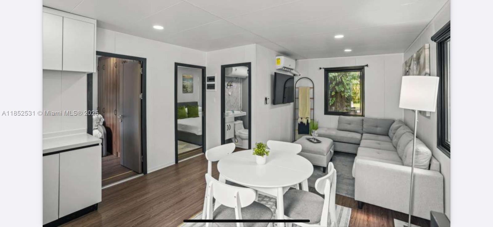 0 Golden Gate Estate, Unit 46 Naples, FL 34120 - Photo 3 of 16 a living room with furniture and a table