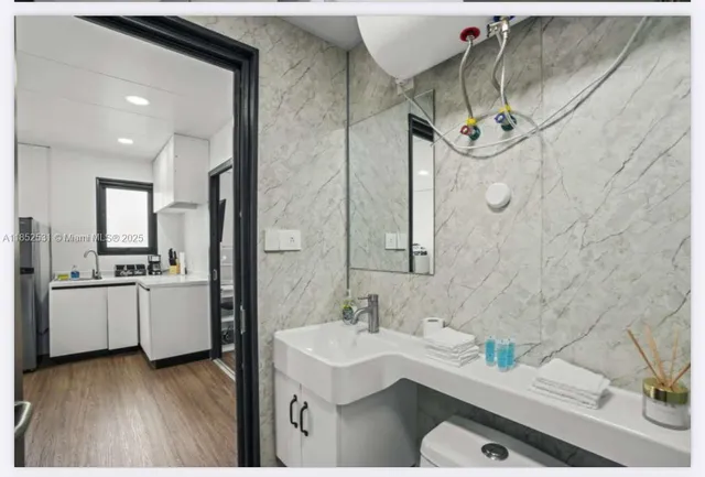 a bathroom with a sink and a mirror