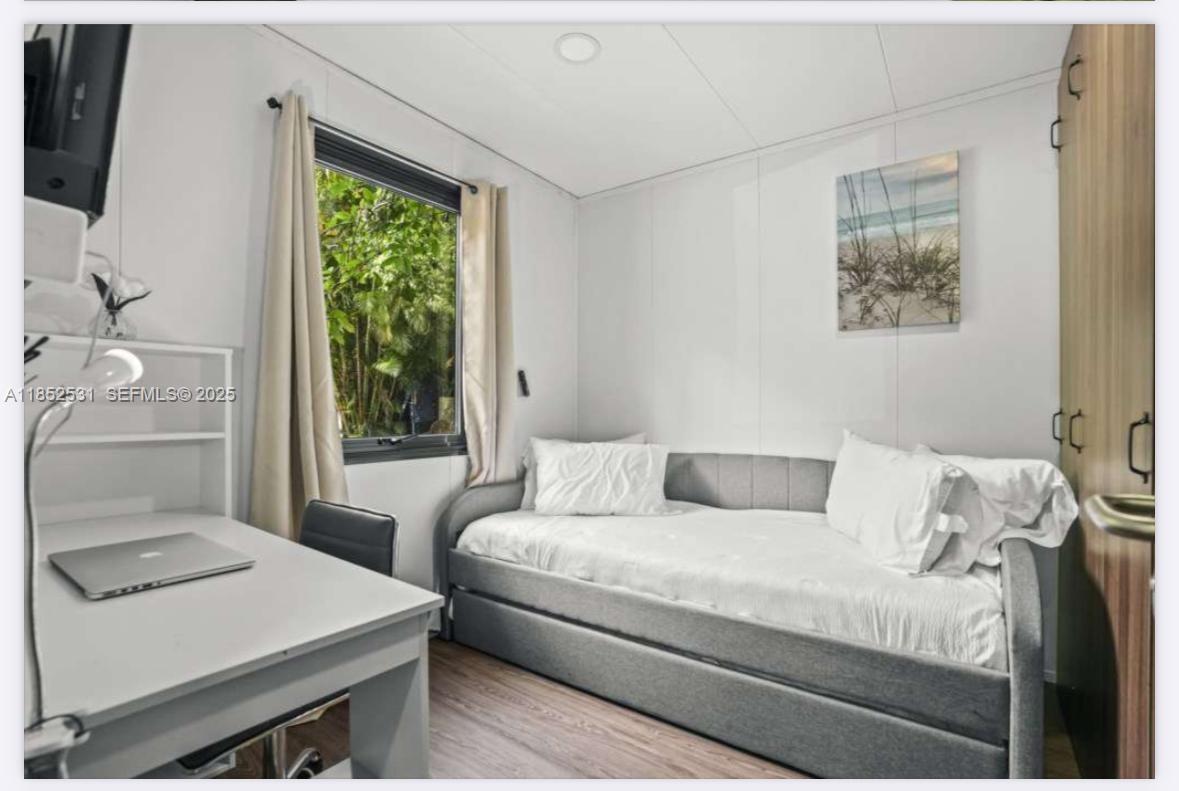 0 Golden Gate Estate, Unit 46 Naples, FL 34120 - Photo 9 of 16 a living room with a couch and a table