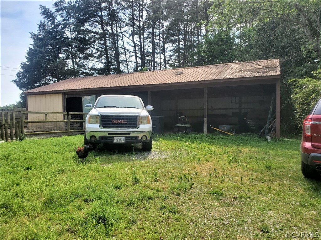 17528 Old Ridge Road Montpelier, VA 23192 - Photo 14 of 19 a backyard of a house with yard and trampoline