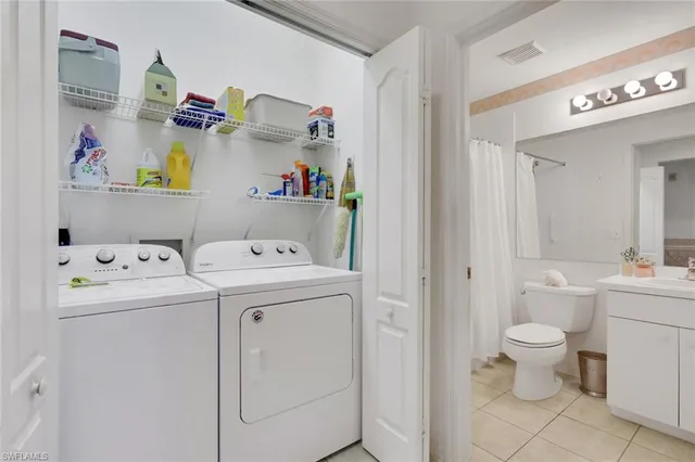 a utility room with dryer and washer