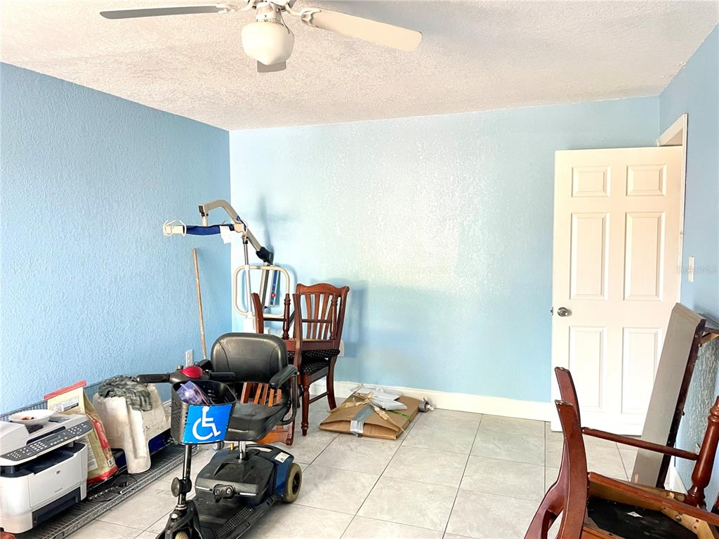 307 South Hiawassee Road Orlando, FL 32835 - Photo 13 of 13 a living room with furniture and a window
