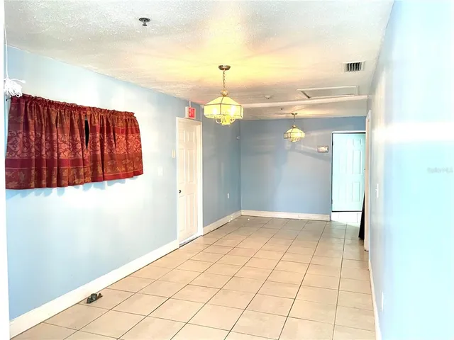 a view of a livingroom with wooden floor
