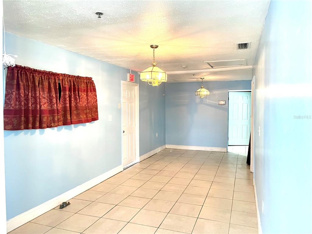 307 South Hiawassee Road Orlando, FL 32835 - Photo 5 of 13 a view of a livingroom with wooden floor