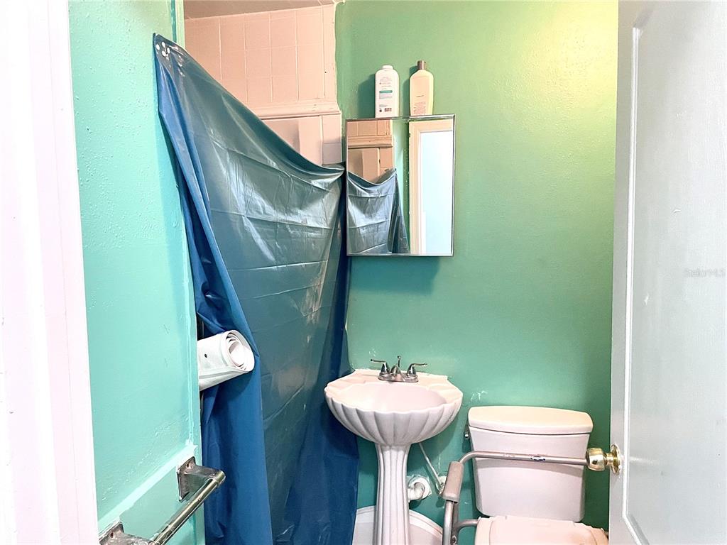 307 South Hiawassee Road Orlando, FL 32835 - Photo 8 of 13 a bathroom with a toilet and a sink