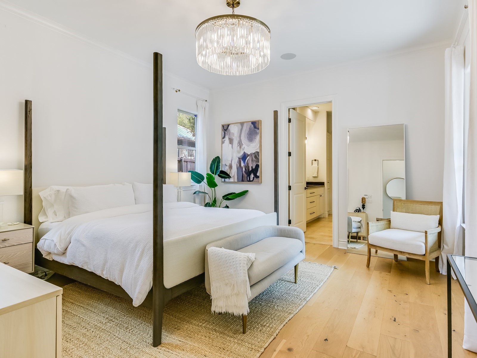 809 Kinney Avenue Austin, TX 78704 - Photo 13 of 21 a spacious bedroom with a bed and a couch
