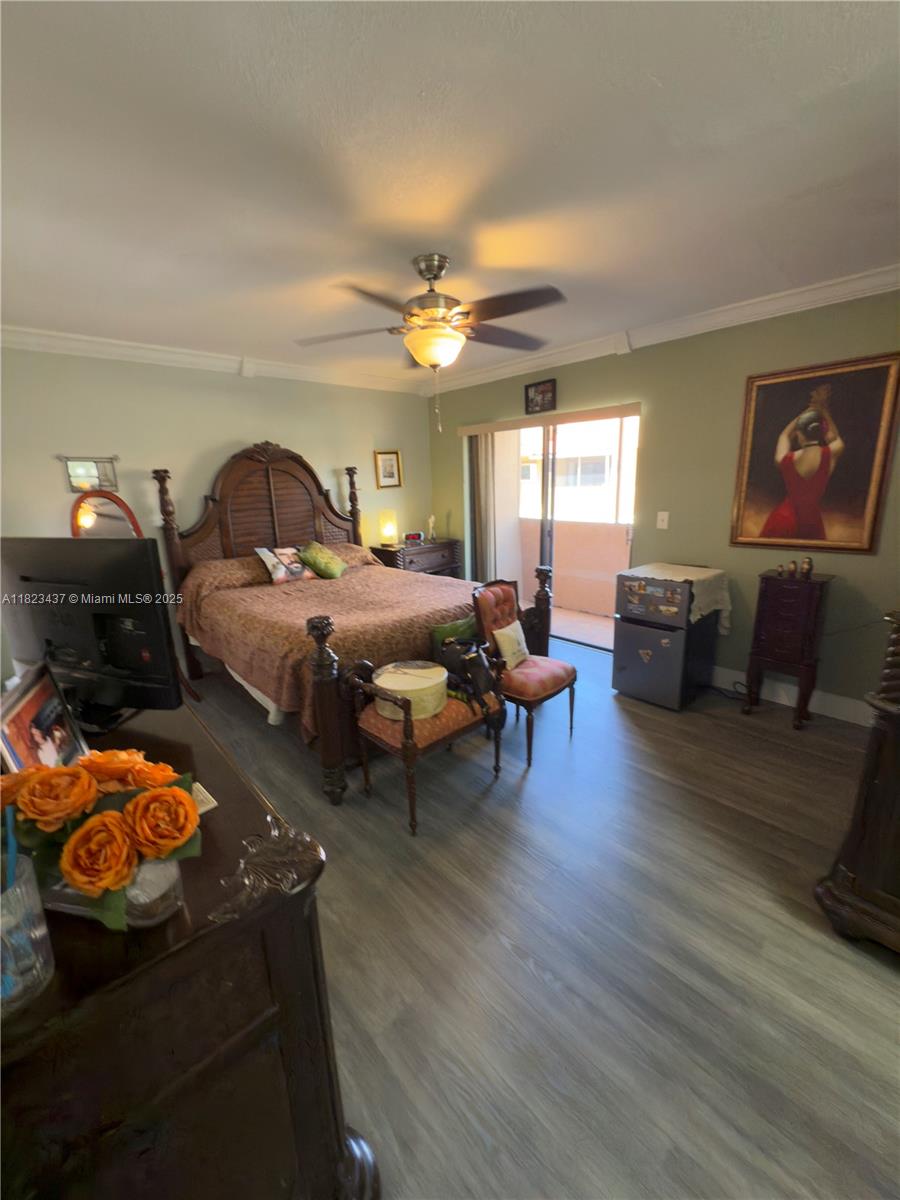 1651 Southwest 120th Avenue Pembroke Pines, FL 33025 - Photo 21 of 34 a living room with furniture and a chandelier