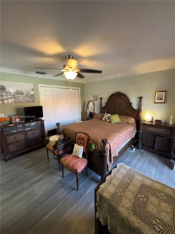a view of a porch with a table and chairs