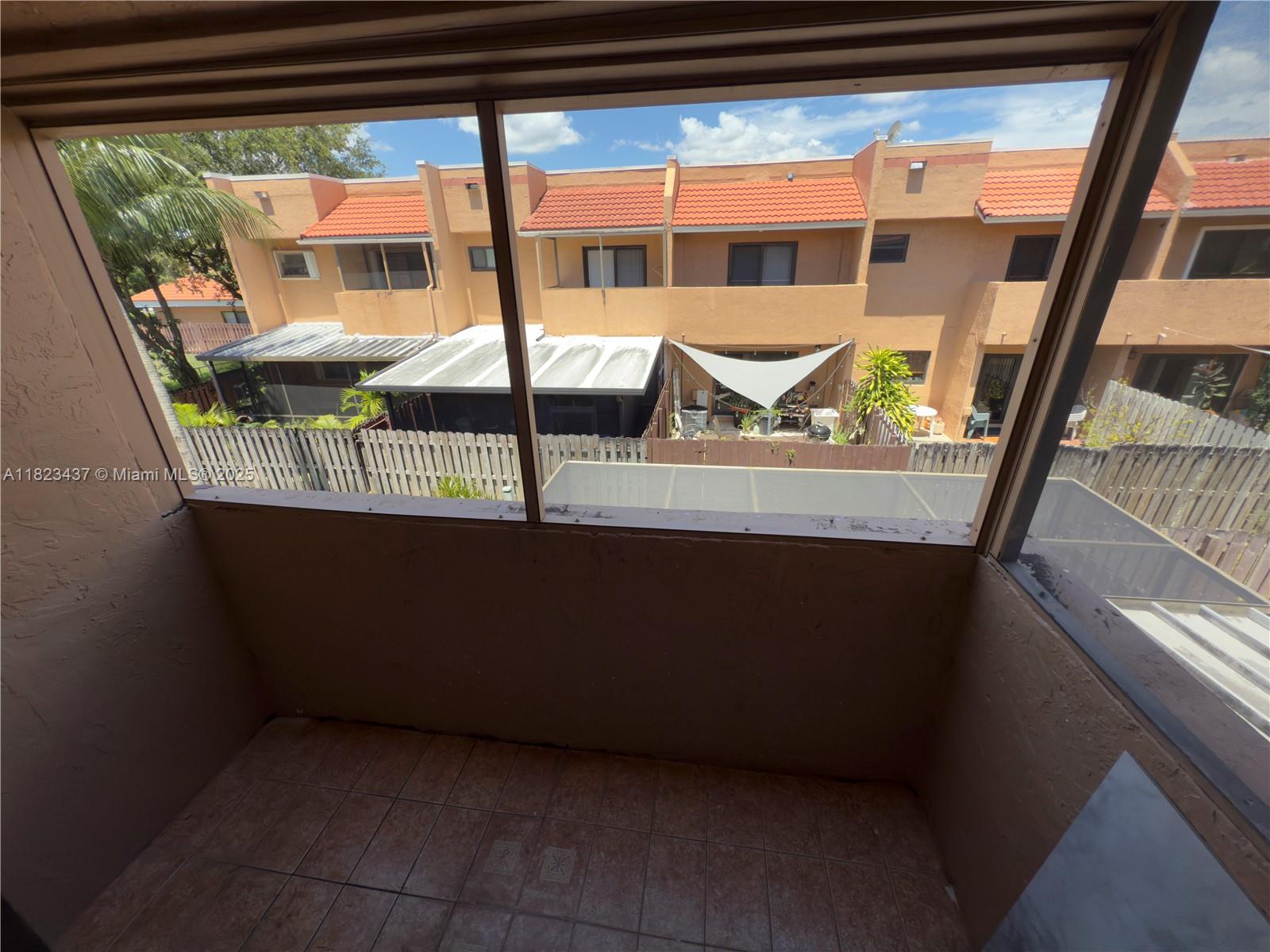1651 Southwest 120th Avenue Pembroke Pines, FL 33025 - Photo 23 of 34 a view of a porch with a table and chairs