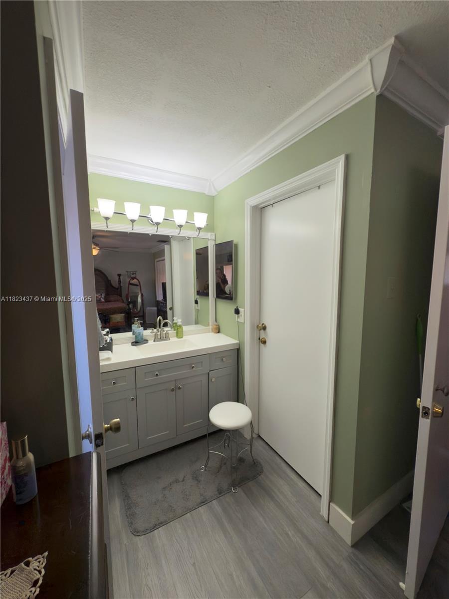 1651 Southwest 120th Avenue Pembroke Pines, FL 33025 - Photo 24 of 34 a bathroom with a granite countertop sink toilet and mirror
