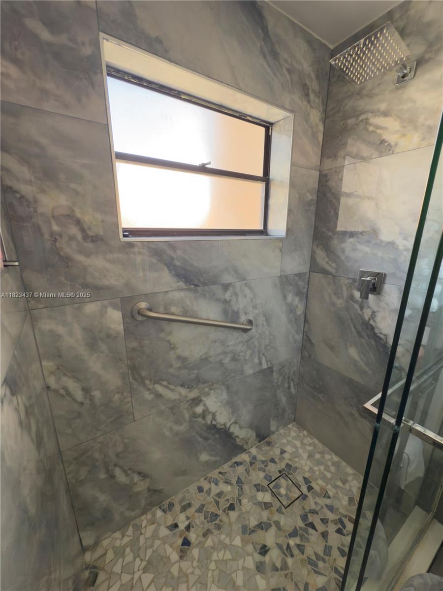 1651 Southwest 120th Avenue Pembroke Pines, FL 33025 - Photo 26 of 34 a bathroom with a window