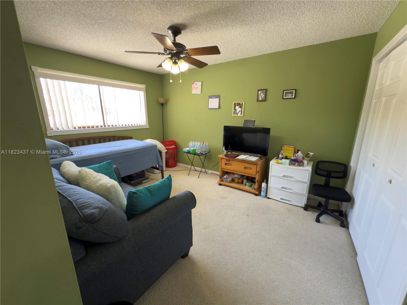 1651 Southwest 120th Avenue Pembroke Pines, FL 33025 - Photo 28 of 34 a living room with furniture and a window