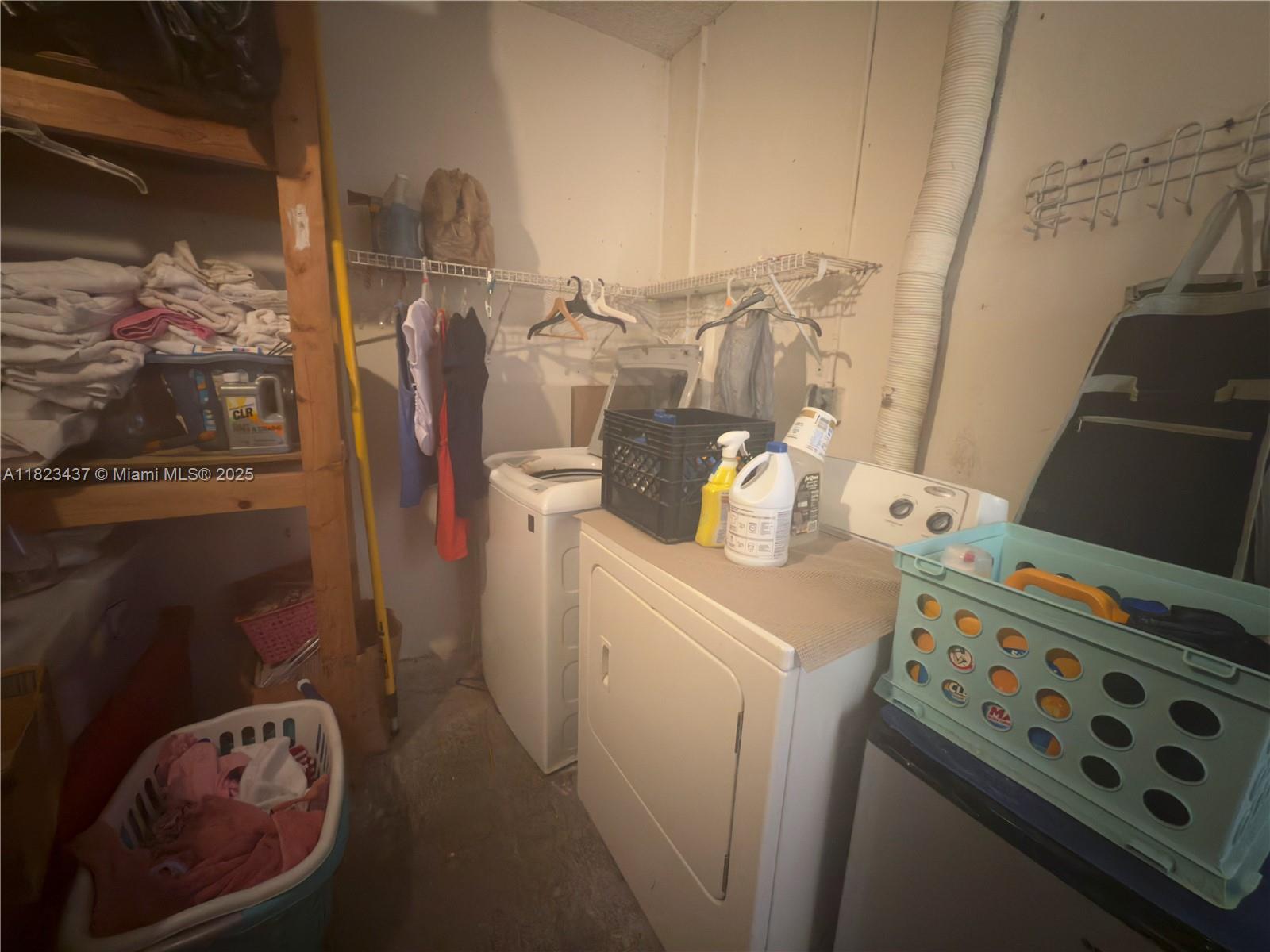 1651 Southwest 120th Avenue Pembroke Pines, FL 33025 - Photo 33 of 34 a utility room with dryer and washer