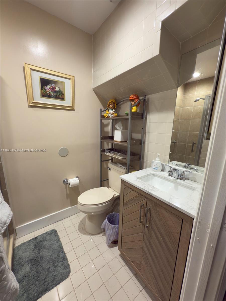 1651 Southwest 120th Avenue Pembroke Pines, FL 33025 - Photo 8 of 34 a bathroom with a toilet sink and mirror