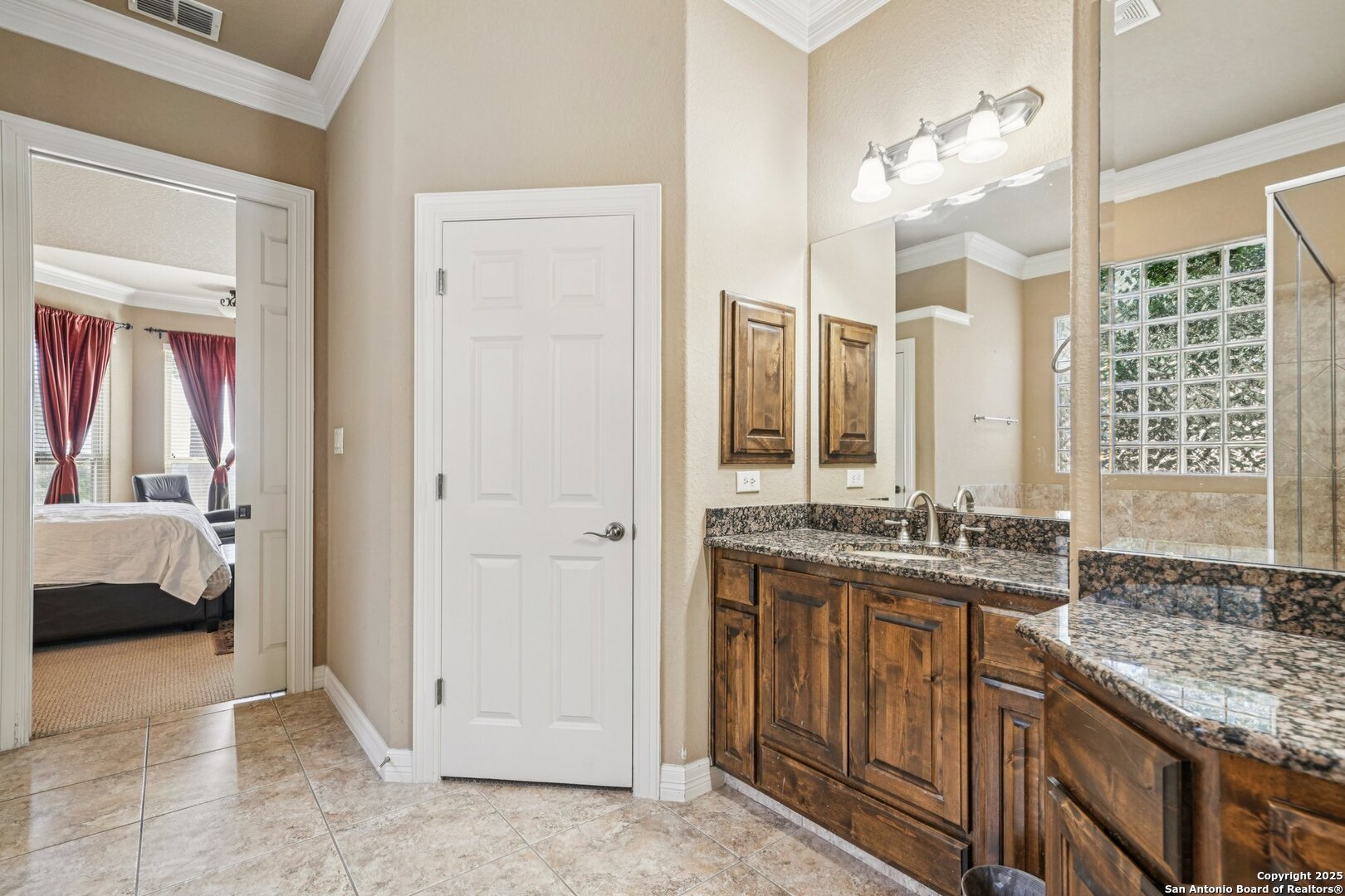 718 Ruidosa Downs Helotes, TX 78023 - Photo 47 of 50 a en suite bathroom with a granite countertop sink and a mirror