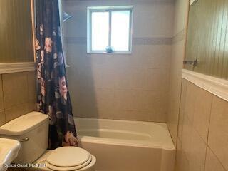1055 Marlin Drive Rockledge, FL 32955 - Photo 7 of 14 a bathroom with a toilet and a shower