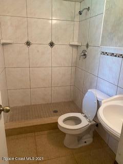 1055 Marlin Drive Rockledge, FL 32955 - Photo 10 of 14 a white toilet sitting next to a bath tub and shower