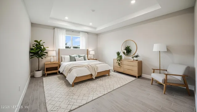 a bed room with a bed and a chair