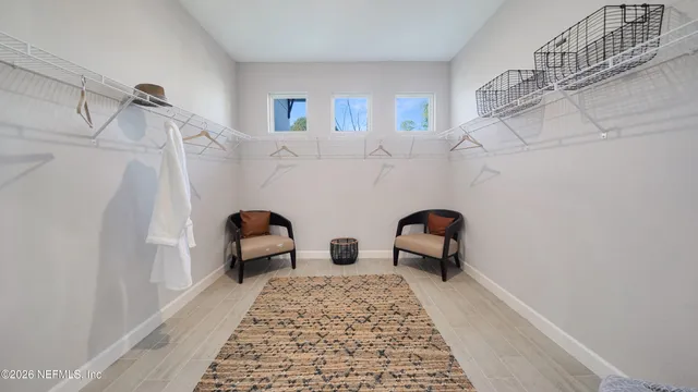 a bathroom with a sink and a window