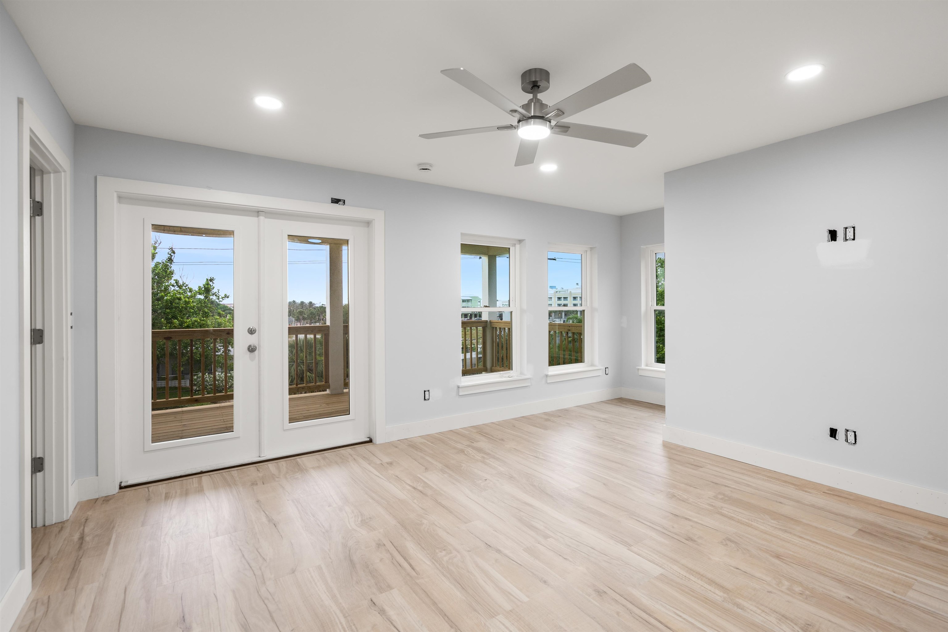 137 Ferrol Road St. Augustine, FL 32084 - Photo 7 of 53 a view of an empty room with wooden floor and a window